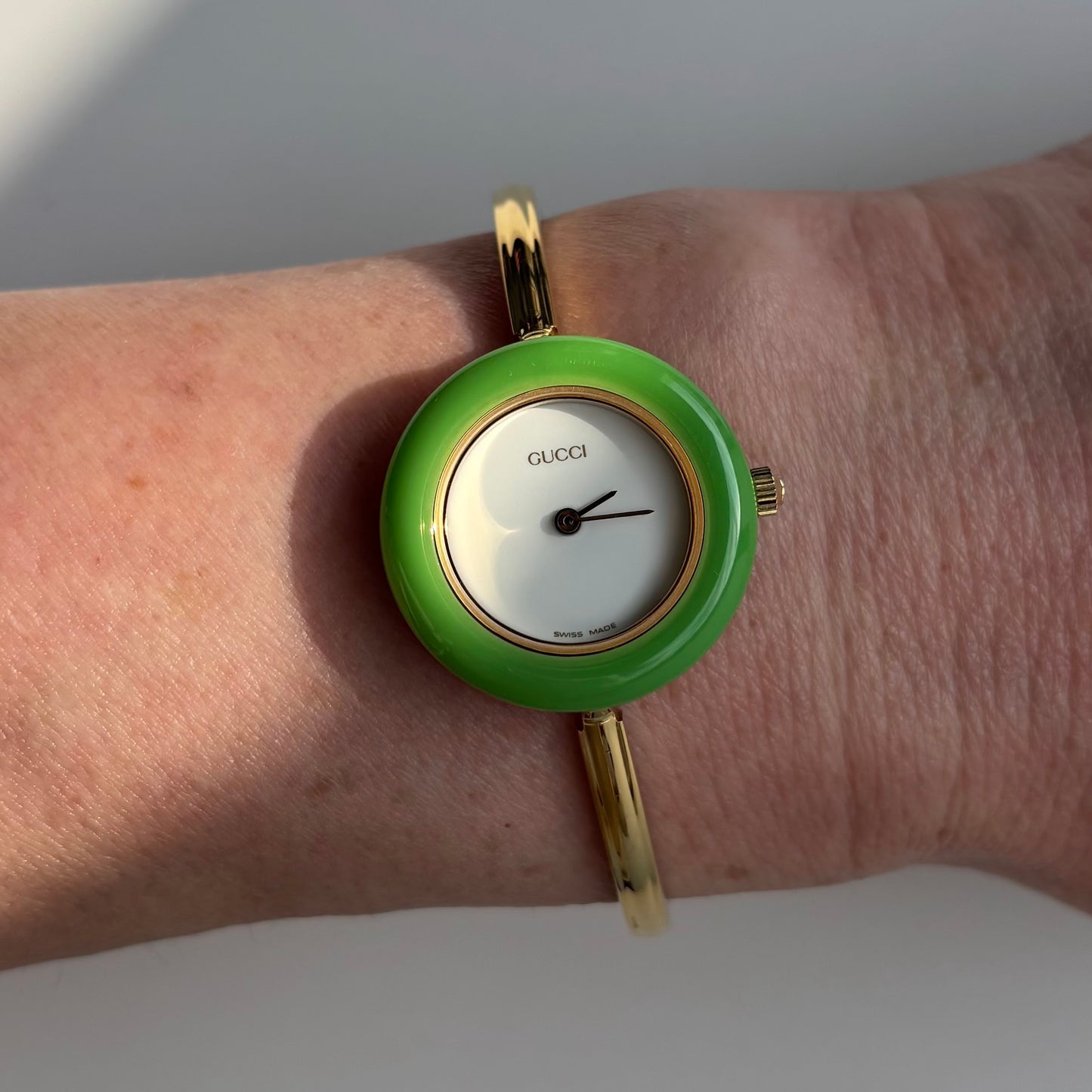 Gucci 1990s Interchangeable Bezel Gold Plated Bangle Watch with 12 bezels, case