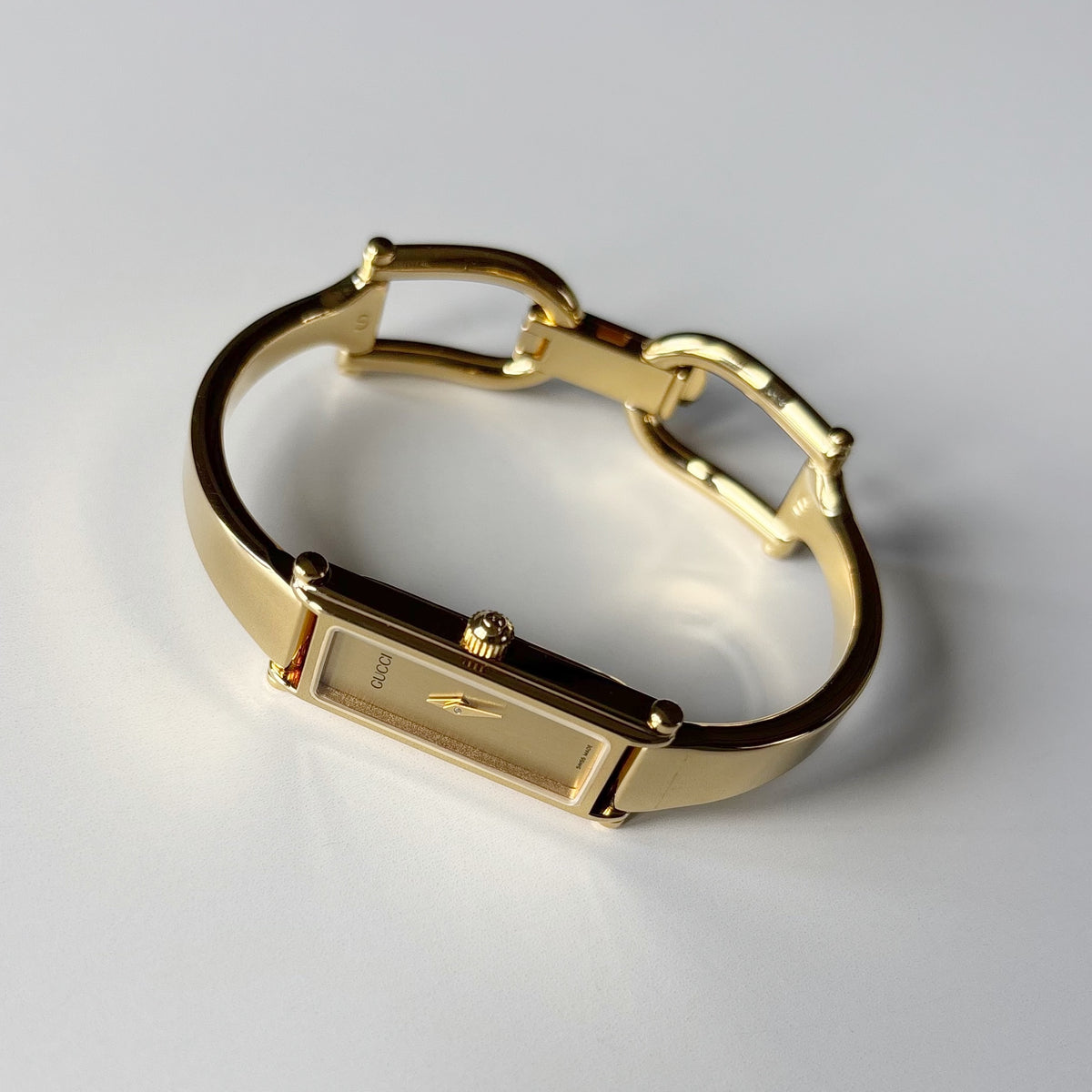Gucci 1990s Rectangular Gold Dial Gold Plated Bangle Watch (Small)