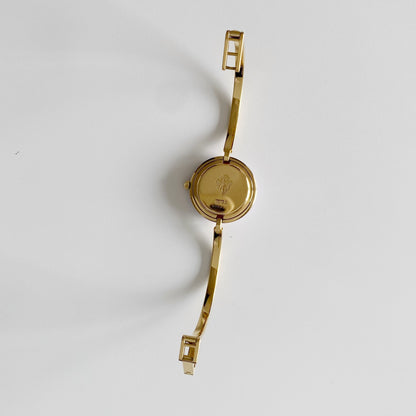 Gucci 1990s Interchangeable Bezel Gold Plated Bangle Watch with 12 bezels, case