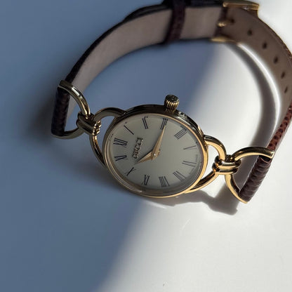 Gucci 1990s Round Cream Dial Horsebit Gold Plated Watch