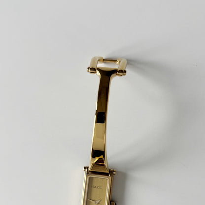 Gucci 1990s Gold Rectangular Dial Gold Plated Bangle Watch