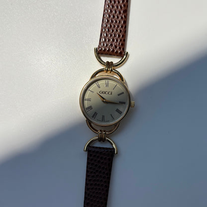 Gucci 1990s Round Cream Dial Horsebit Gold Plated Watch