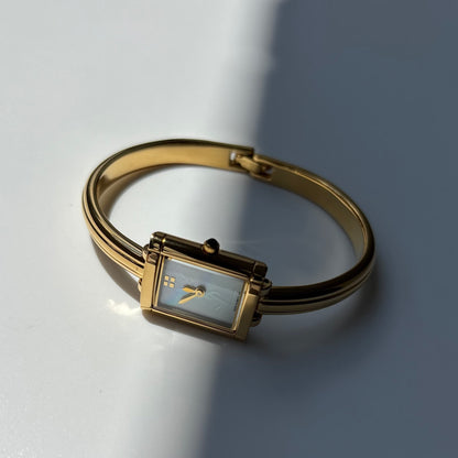 Yves Saint Laurent 1990s Seashell Dial Gold Plated Bangle Watch