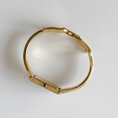 Gucci 1990s Rectangular Gold Dial Gold Plated Bangle Watch