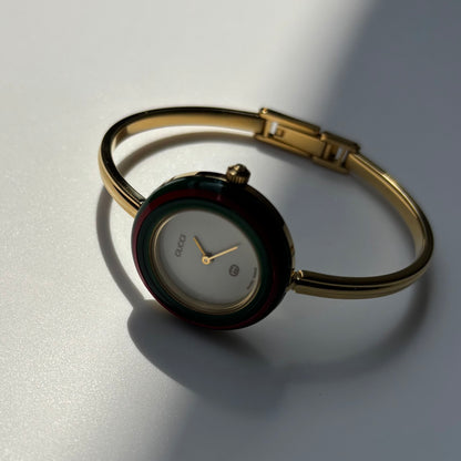 Gucci 1990s Interchangeable Bezel Gold Plated Bangle Watch with 12 bezels, case