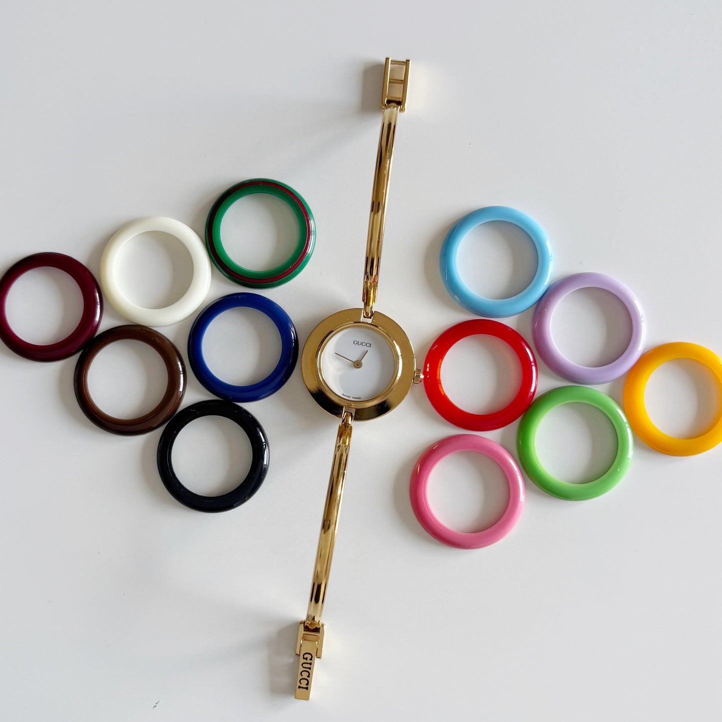 Gucci 1990s Interchangeable Bezel Gold Plated Bangle Watch with 12 bezels, case