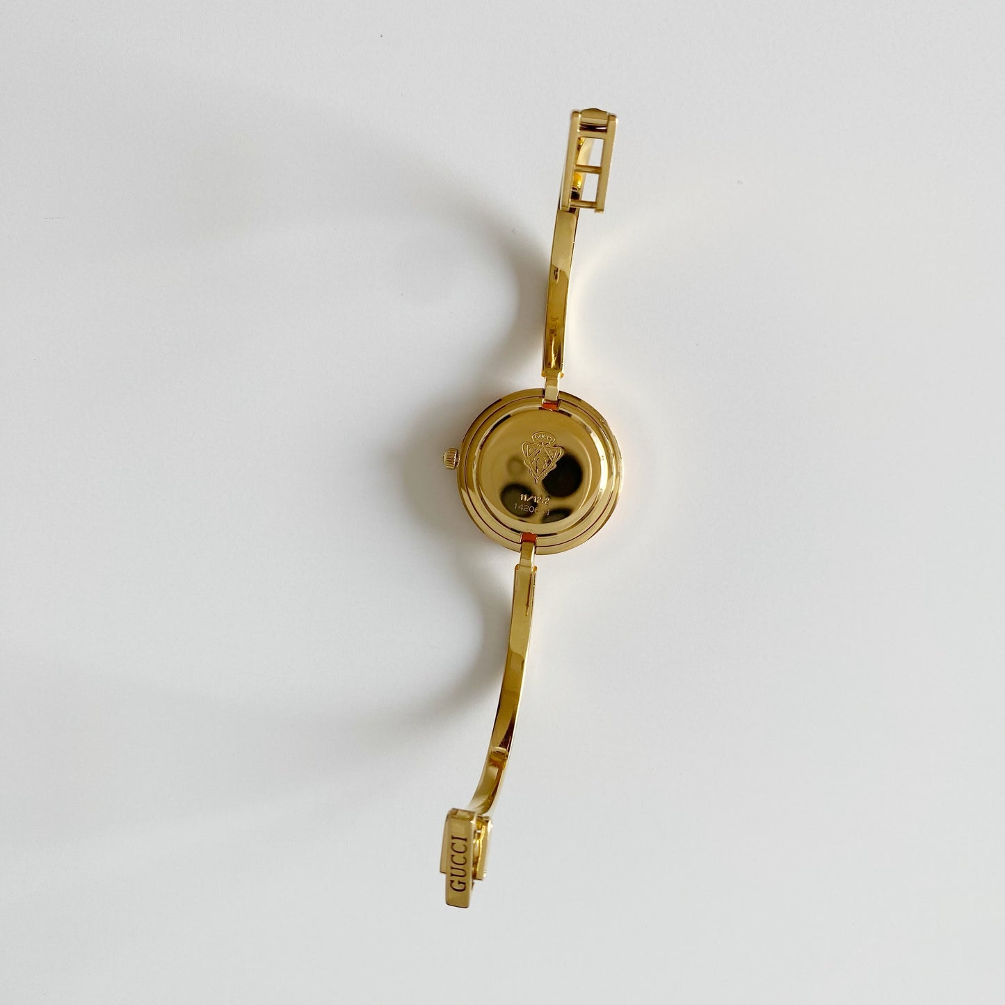 Gucci 1990s Interchangeable Bezel Gold Plated Bangle Watch with 12 bezels, case