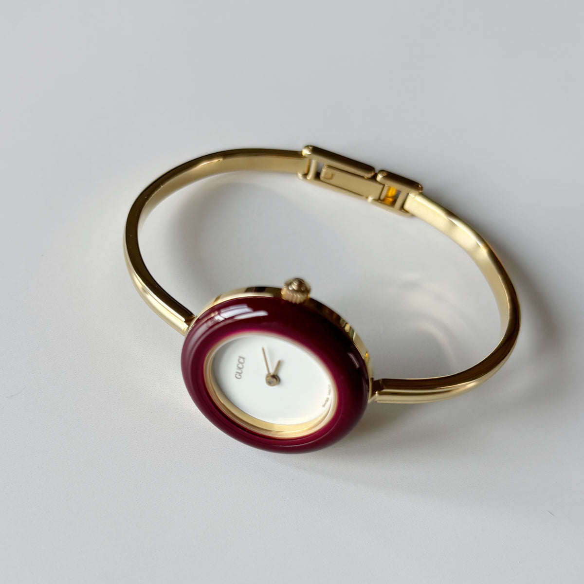 Gucci 1990s Interchangeable Bezel Gold Plated Bangle Watch with 12 bezels, case