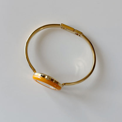 Gucci 1990s Interchangeable Bezel Gold Plated Bangle Watch with 12 bezels, case