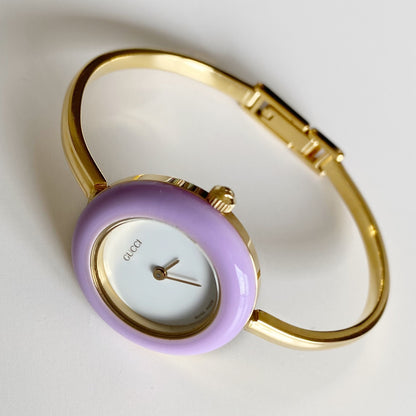 Gucci 1990s Interchangeable Bezel Gold Plated Bangle Watch with 12 bezels, case