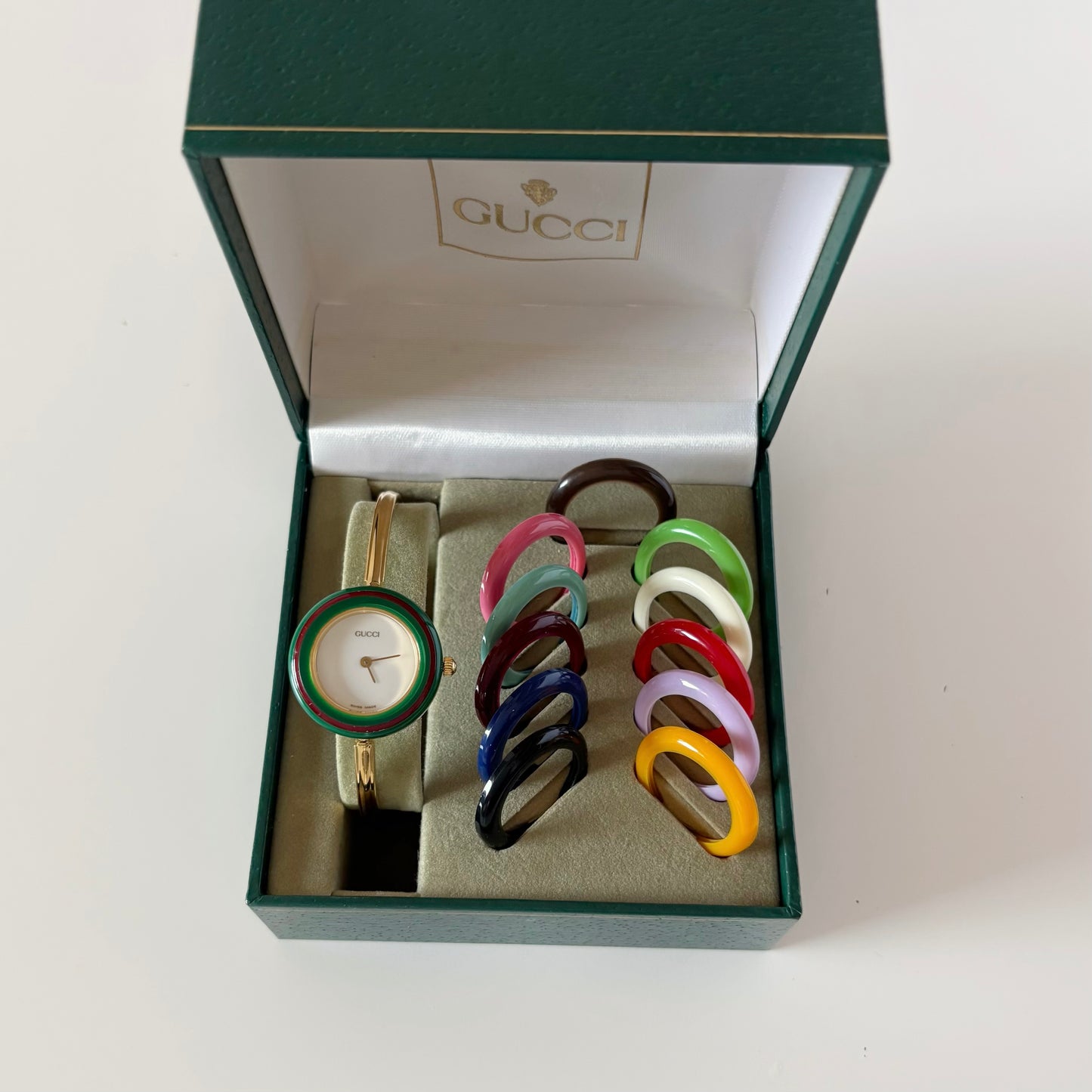 Gucci 1990s Interchangeable Bezel Gold Plated Bangle Watch with 12 bezels, case