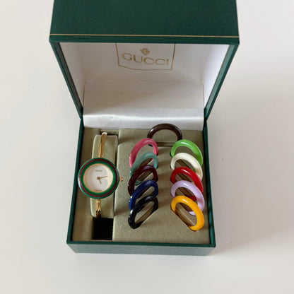 Gucci 1990s Interchangeable Bezel Gold Plated Bangle Watch with 12 bezels, case