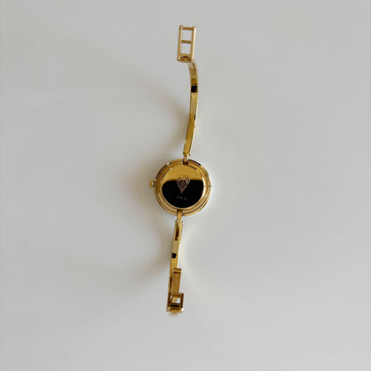 Gucci 1980s Interchangeable Bezel Gold Plated Bangle Watch with 12 bezels, case