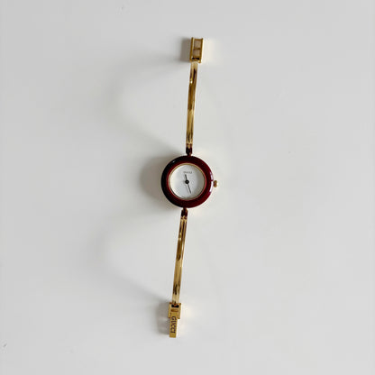 Gucci 1990s Interchangeable Bezel Gold Plated Bangle Watch with 12 bezels, case