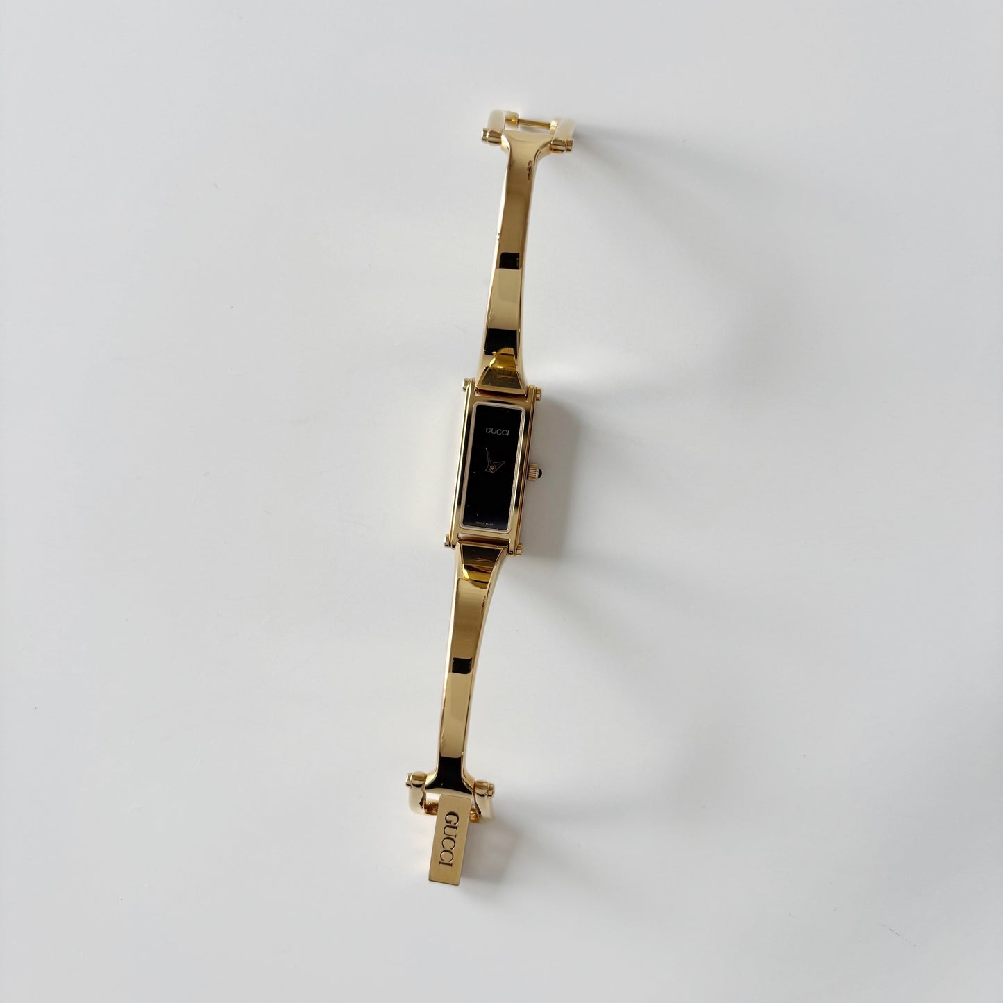 Gucci 1990s Rectangular Black Dial Gold Plated Bangle Watch
