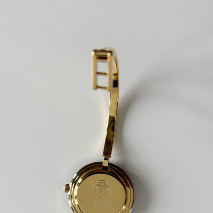 Gucci 1990s Interchangeable Bezel Gold Plated Bangle Watch with 12 bezels, case