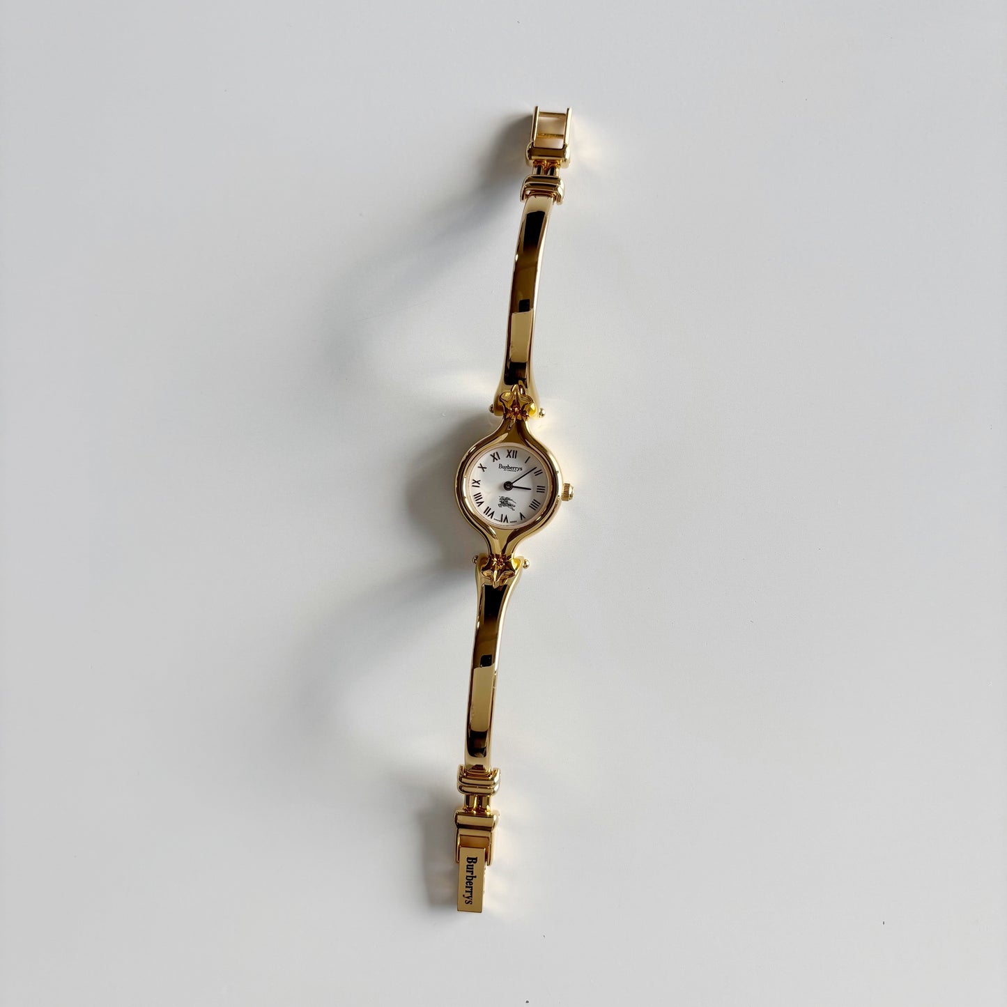 Burberry 1990s Round Dial Gold Plated Bangle Watch