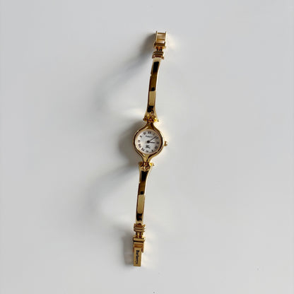 Burberry 1990s Round Dial Gold Plated Bangle Watch