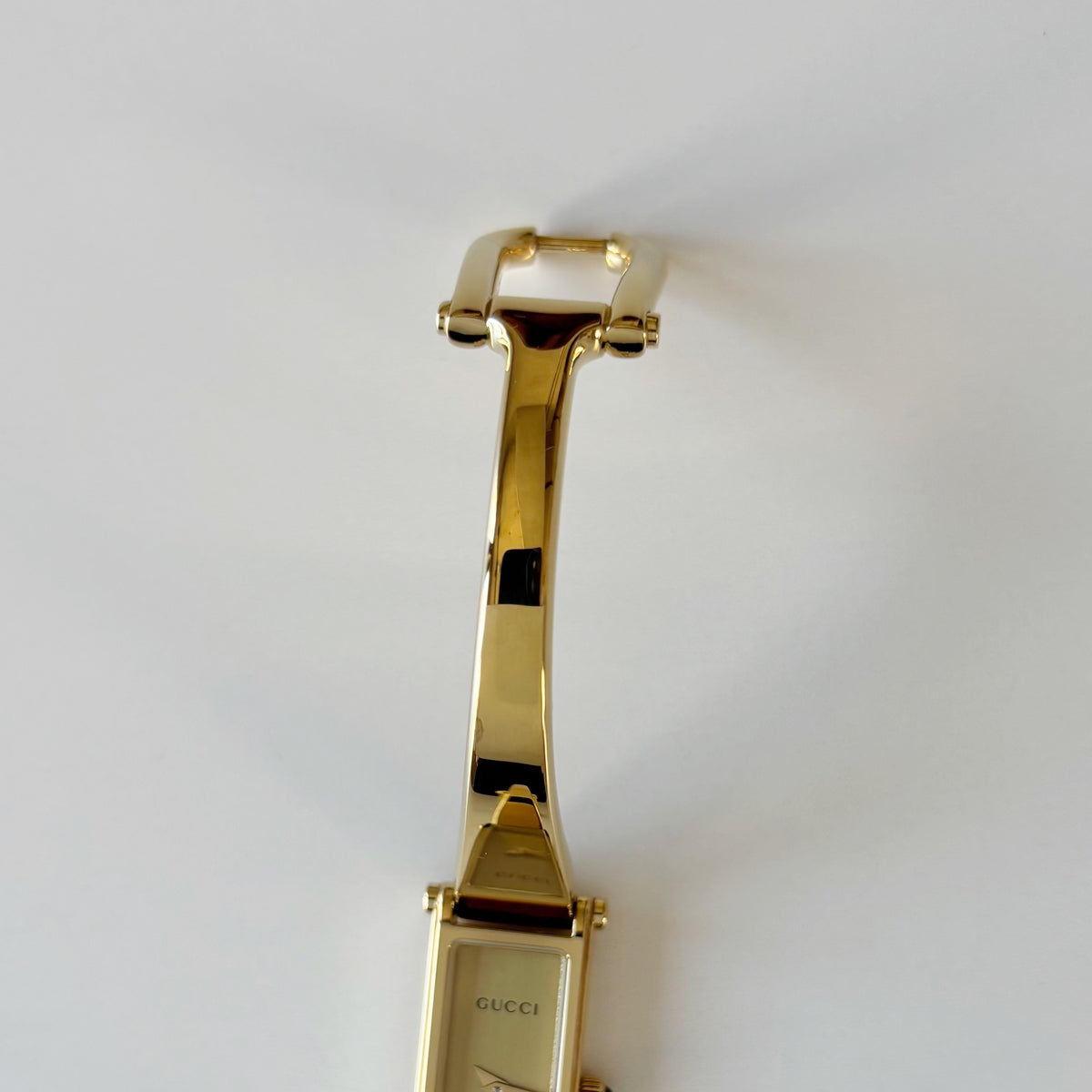Gucci 1990s Rectangular Gold Dial Gold-Plated Watch