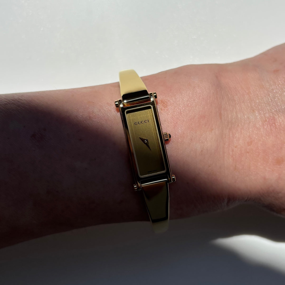 Gucci 1990s Rectangular Gold Dial Gold-Plated Watch