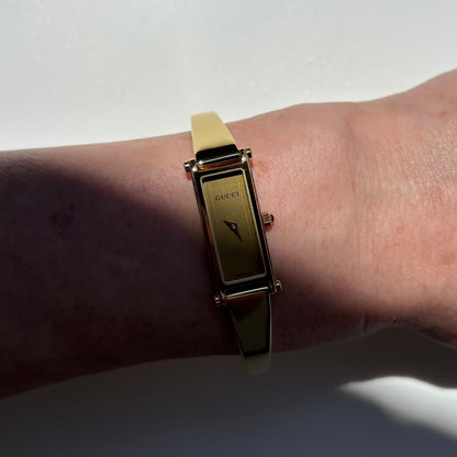 Gucci 1990s Rectangular Gold Dial Gold-Plated Watch