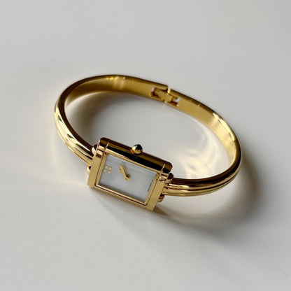 Yves Saint Laurent 1990s Seashell Dial Gold Plated Bangle Watch