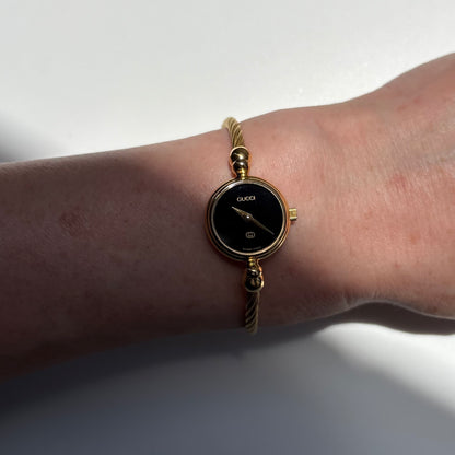 Gucci 1990s Black Round Dial Cable Gold Plated Bangle Watch
