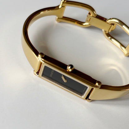 Gucci 1990s Black Rectangular Dial Gold Plated Bangle Watch