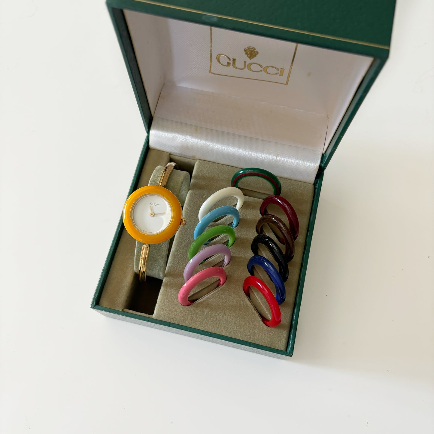 Gucci 1990s Interchangeable Bezel Gold Plated Bangle Watch with 12 bezels, case