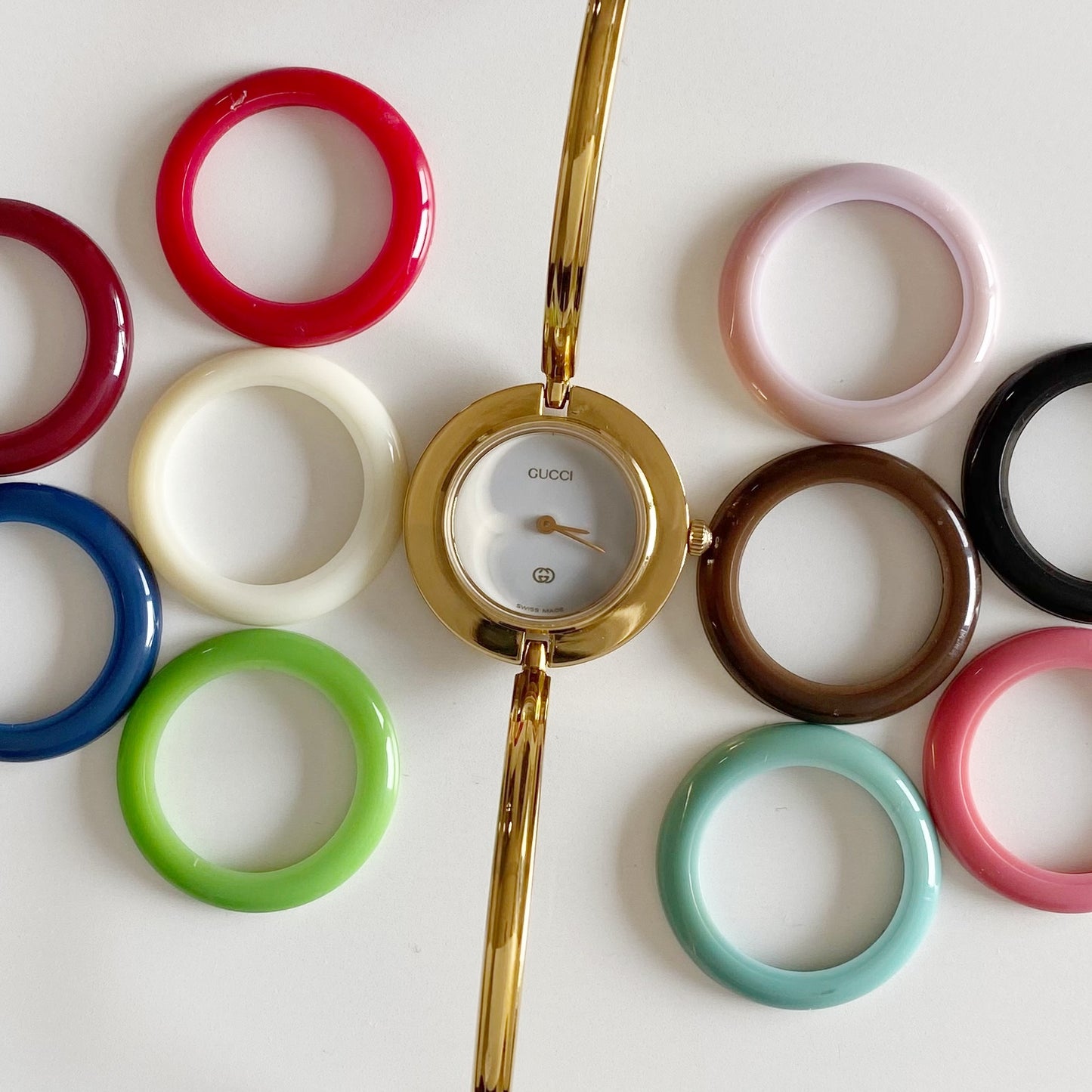 Gucci 1990s Interchangeable Bezel Gold Plated Bangle Watch with 12 bezels, case