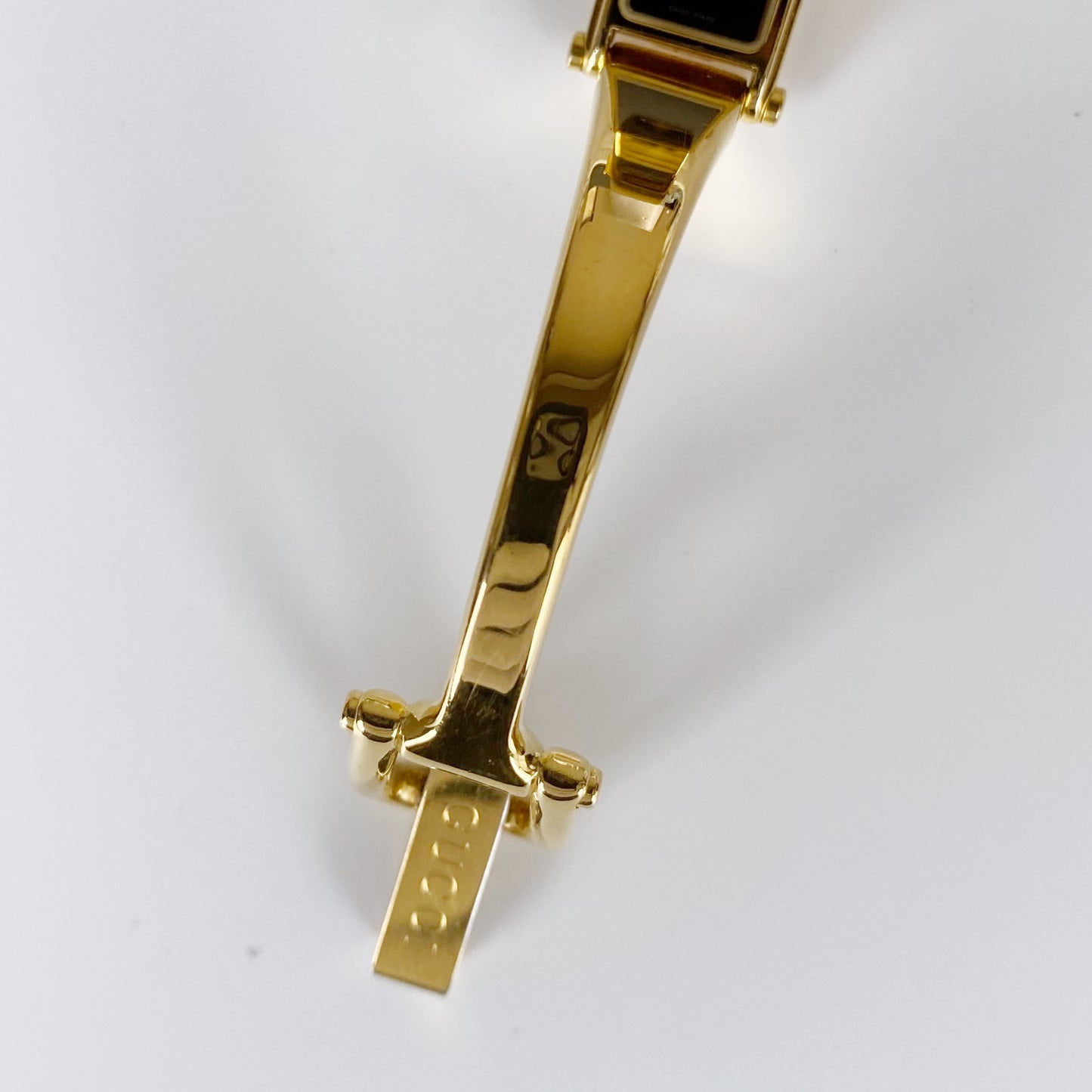 Gucci 1990s Black Dial Rectangular Gold Plated Bangle Watch