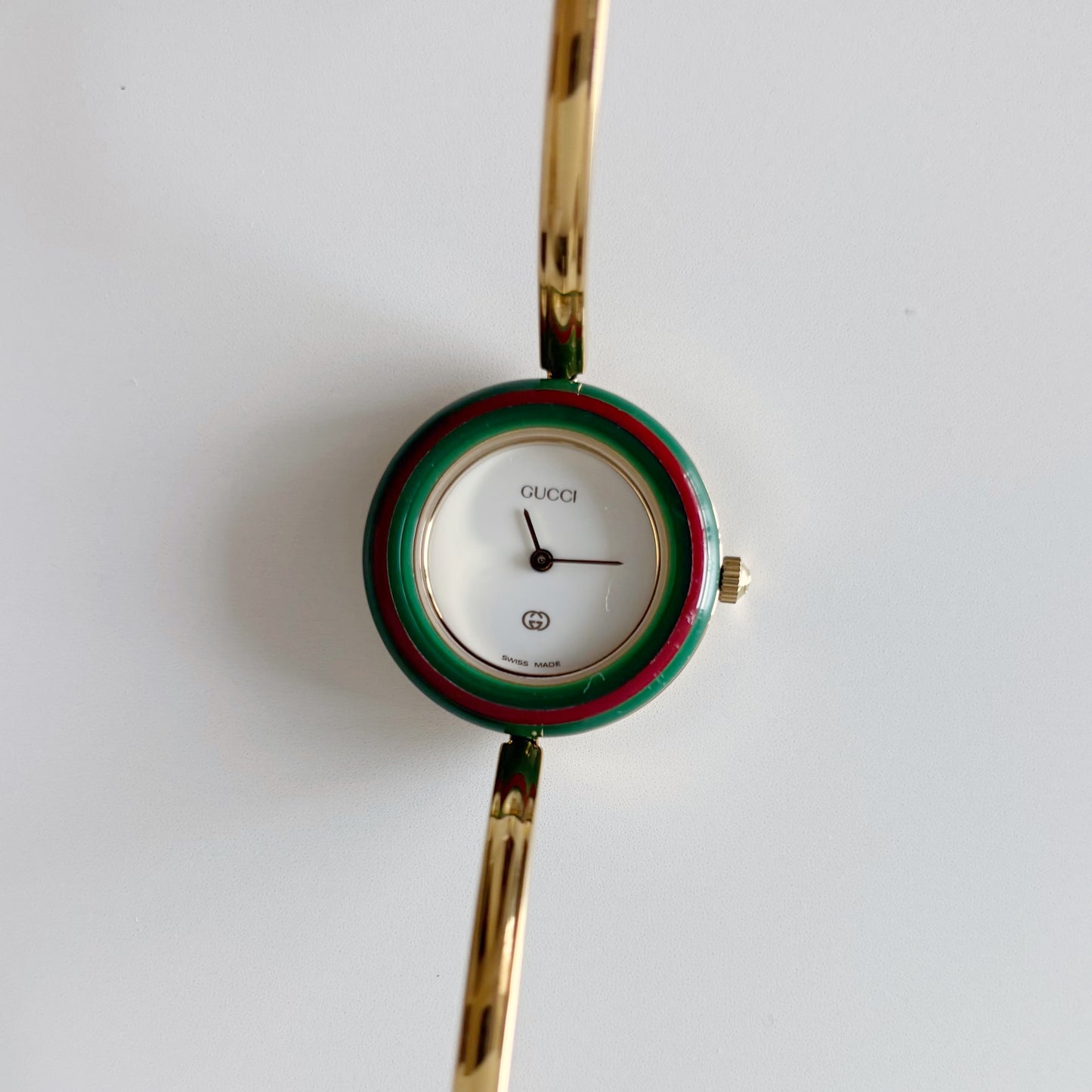 Gucci 1990s Interchangeable Bezel Gold Plated Bangle Watch with 12 bezels, case
