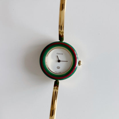 Gucci 1990s Interchangeable Bezel Gold Plated Bangle Watch with 12 bezels, case
