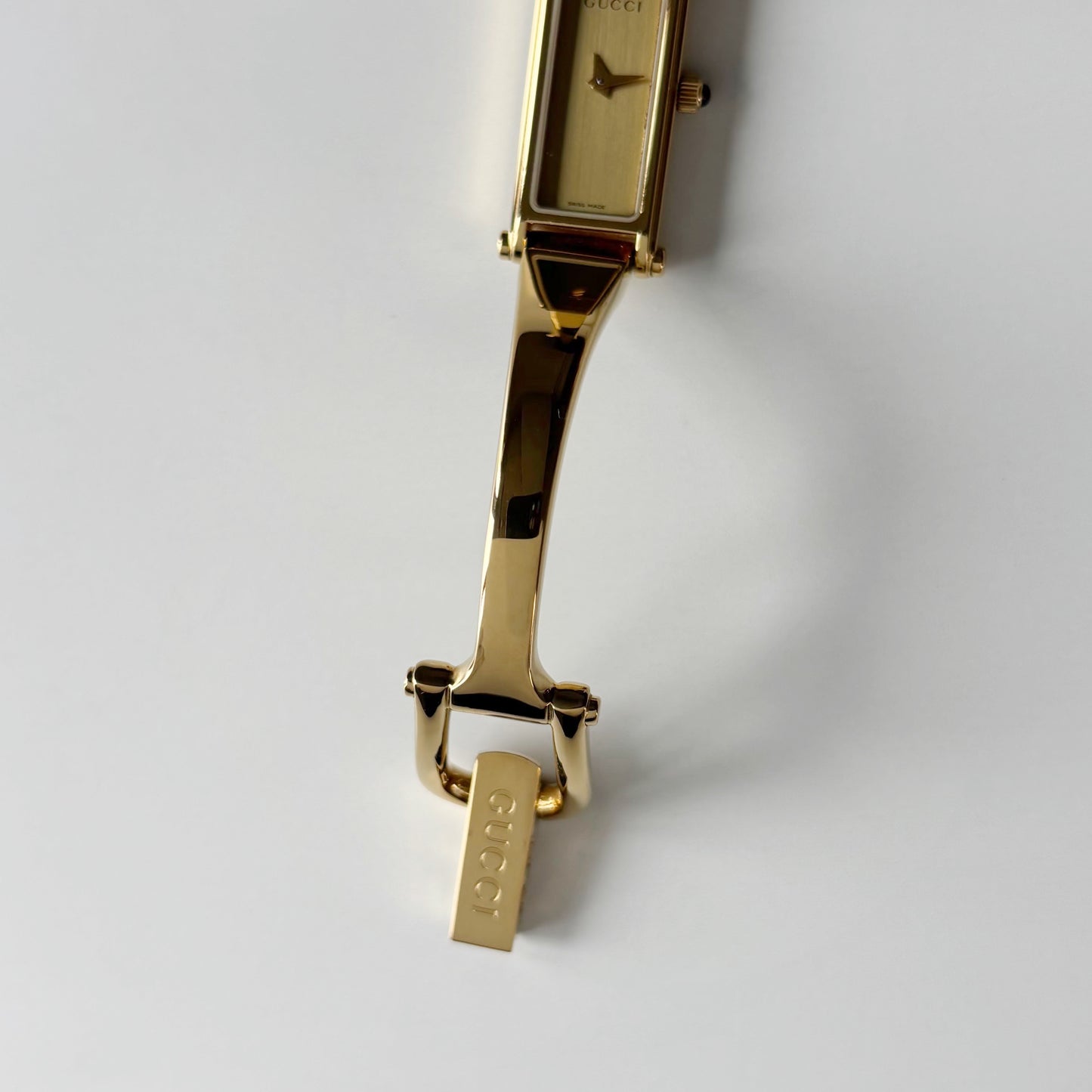 Gucci 1990s Gold Rectangular Dial Gold Plated Bangle Watch (Small)