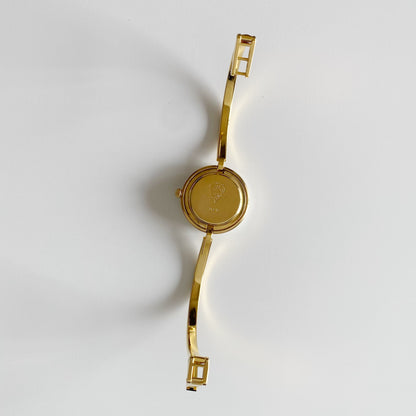 Gucci 1990s Interchangeable Bezel Gold Plated Bangle Watch with 12 bezels, case