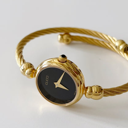 Gucci 1990s Black Dial Gold Plated Bangle Watch