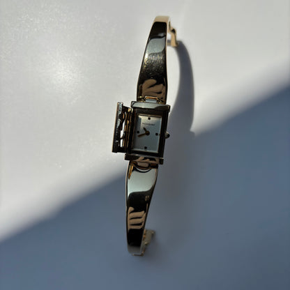 Yves Saint Laurent 1990s Peek a boo Gold Plated Bangle Watch