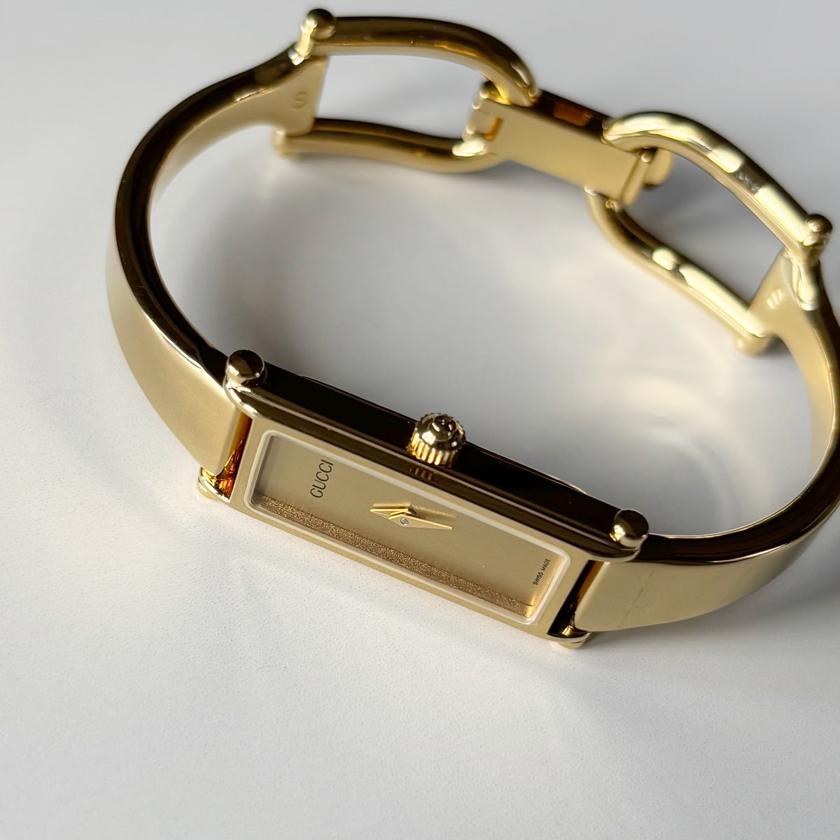 Gucci 1990s Rectangular Gold Dial Gold Plated Bangle Watch (Small)