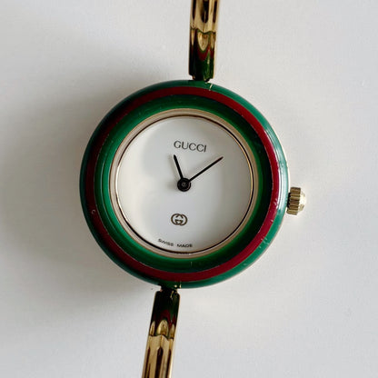 Gucci 1990s Interchangeable Bezel Gold Plated Bangle Watch with 12 bezels, case