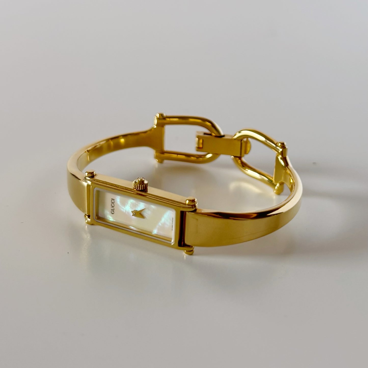 Gucci 1990s Seashell Rectangular Dial Gold Plated Bangle Watch