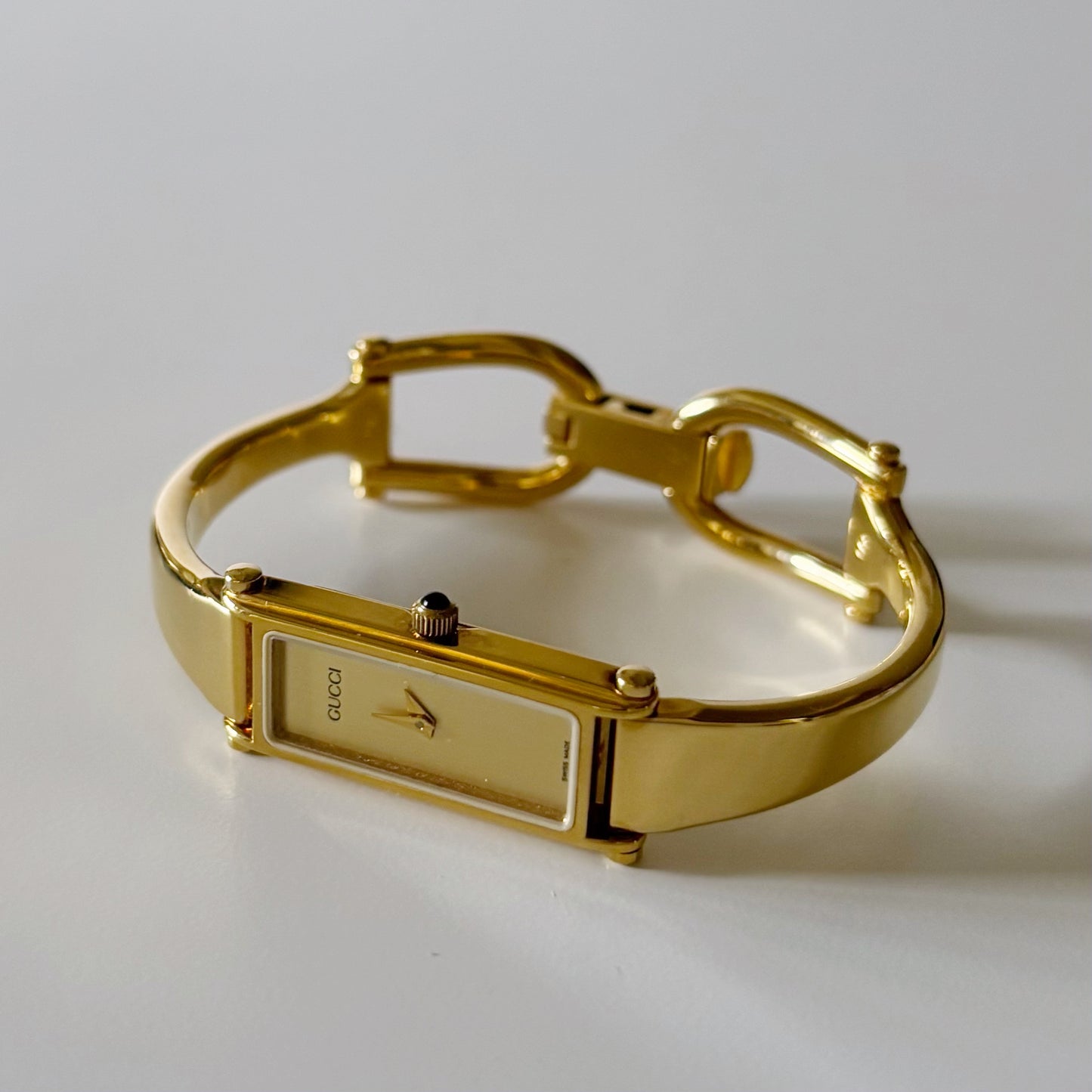 Gucci 1990s Rectangular Gold Dial Gold Plated Bangle Watch (Small)