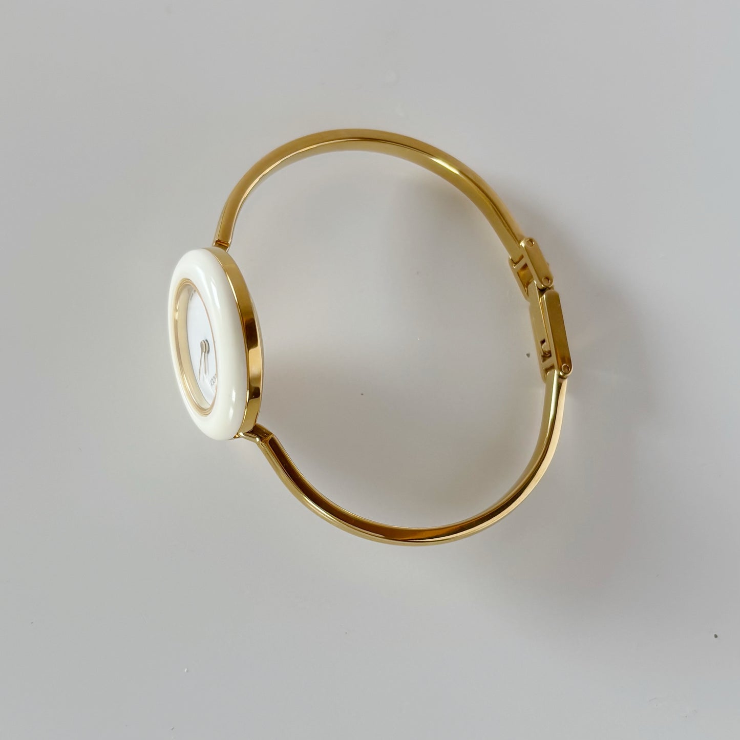 Gucci 1990s Interchangeable Bezel Gold Plated Bangle Watch with 12 bezels, case
