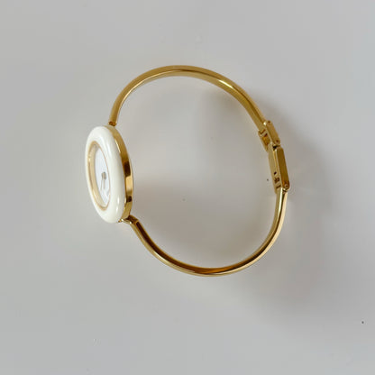 Gucci 1990s Interchangeable Bezel Gold Plated Bangle Watch with 12 bezels, case