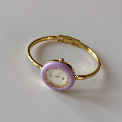 Gucci 1990s Interchangeable Bezel Gold Plated Bangle Watch with 12 bezels, case