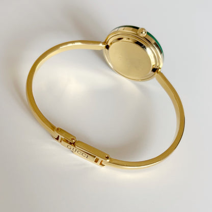 Gucci 1990s Interchangeable Bezel Gold Plated Bangle Watch with 12 bezels, case