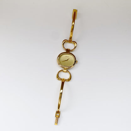 Gucci 1990s Oval Gold Plated Bangle Watch