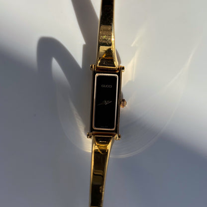 Gucci 1990s Black Rectangular Dial Gold Plated Bangle Watch