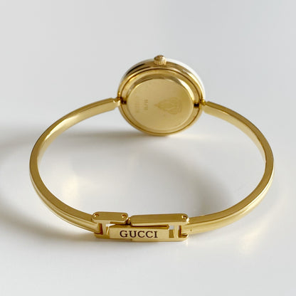 Gucci 1990s Interchangeable Bezel Gold Plated Bangle Watch with 12 bezels, case