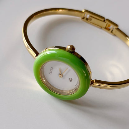 Gucci 1990s Interchangeable Bezel Gold Plated Bangle Watch with 12 bezels, case