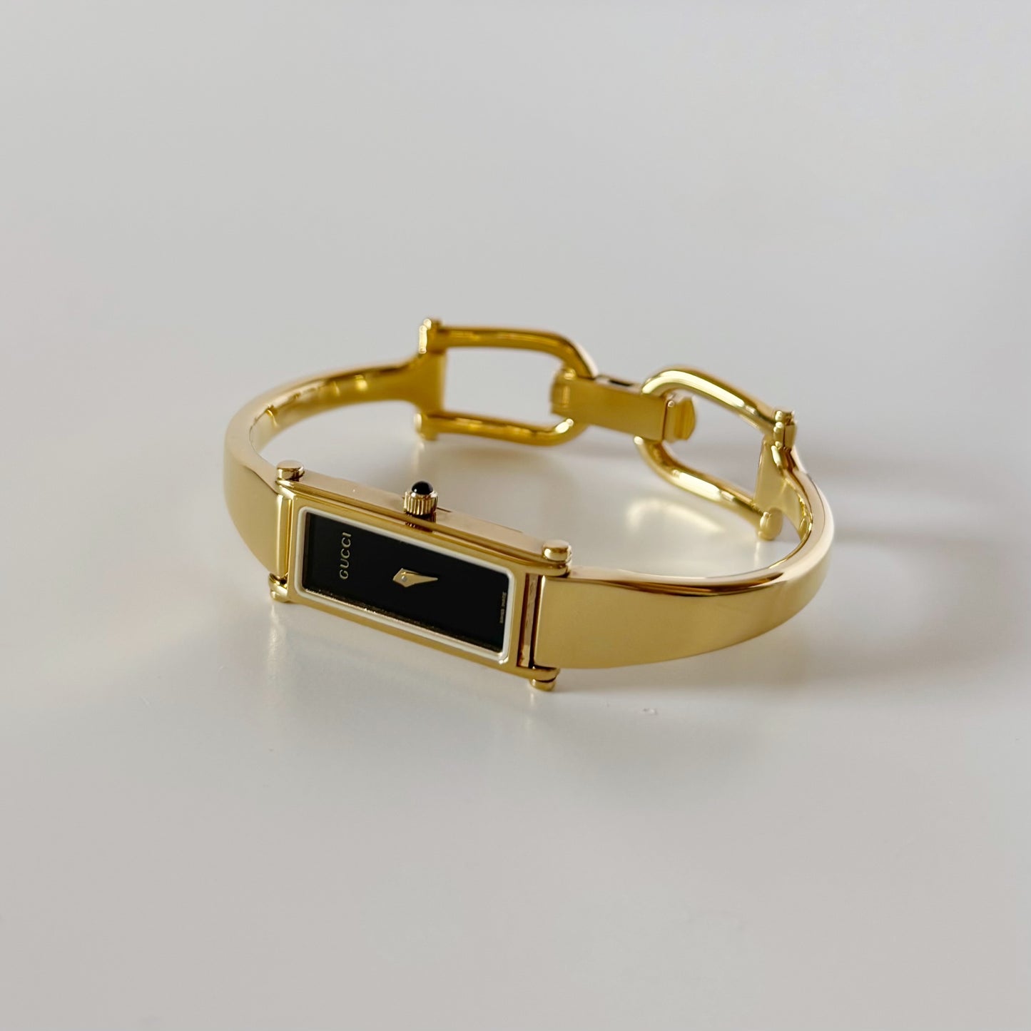 Gucci 1990s Black Rectangular Dial Gold Plated Bangle Watch